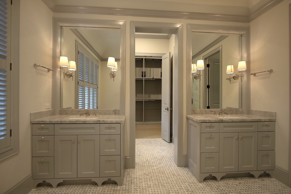 This is an example of a large classic ensuite bathroom in Houston with shaker cabinets, grey cabinets, a freestanding bath, a corner shower, grey tiles, marble tiles, grey walls, marble flooring, a submerged sink, marble worktops, multi-coloured floors and a hinged door.