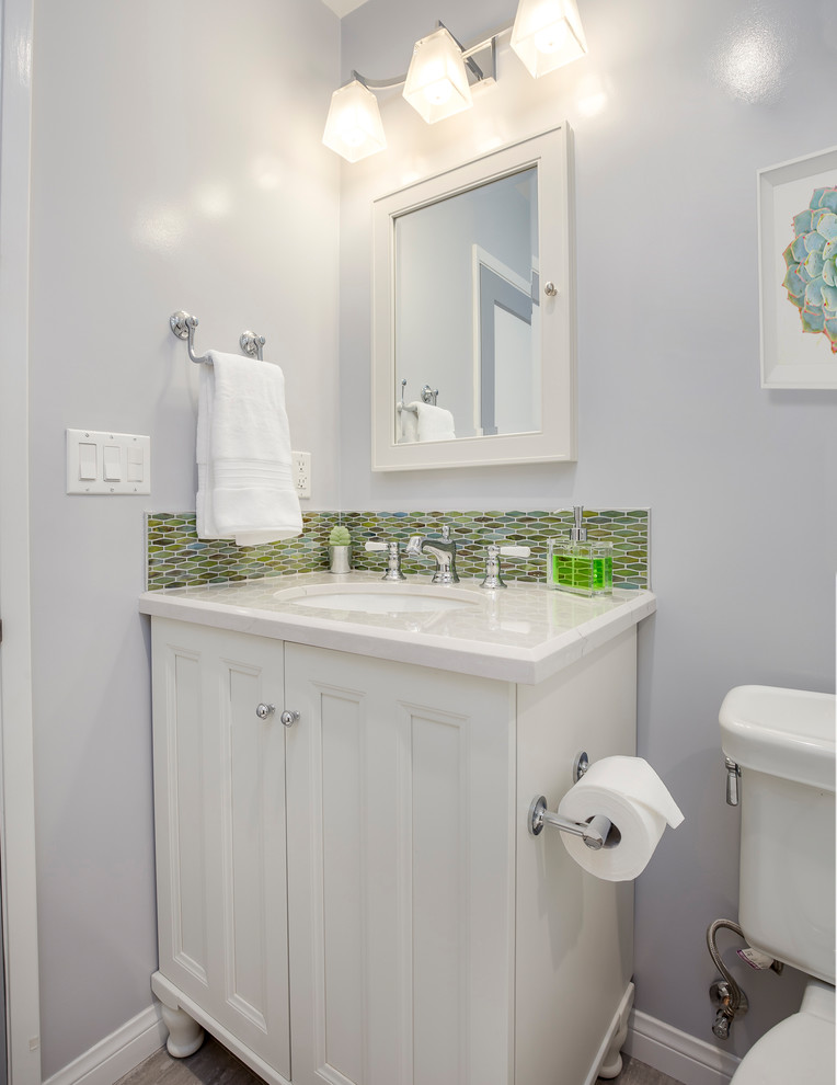 Example of a small transitional multicolored tile and subway tile gray floor and ceramic tile bathroom design in Los Angeles with beaded inset cabinets, white cabinets, a two-piece toilet, gray walls, an undermount sink and quartzite countertops