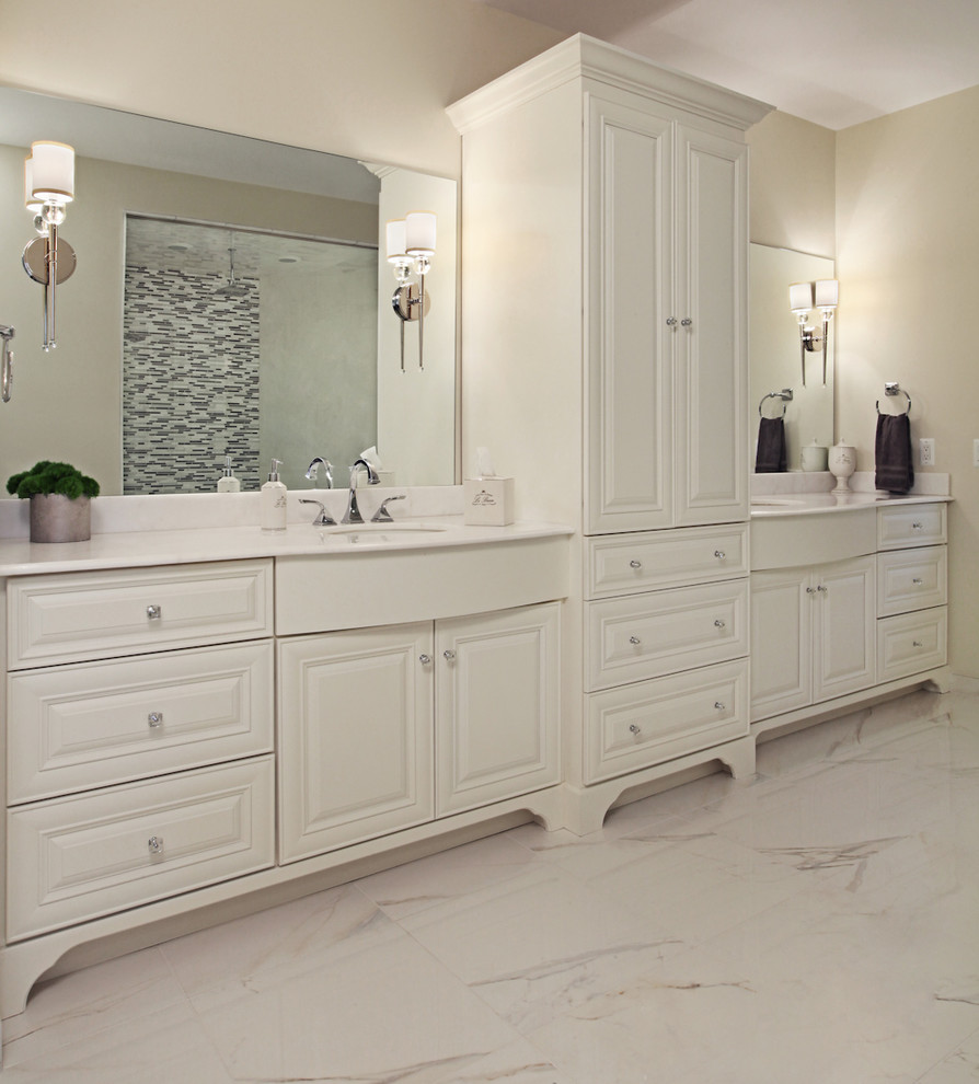 Mid-sized transitional master white tile and matchstick tile marble floor alcove shower photo in Detroit with raised-panel cabinets, white cabinets, a two-piece toilet, white walls, an undermount sink and quartz countertops