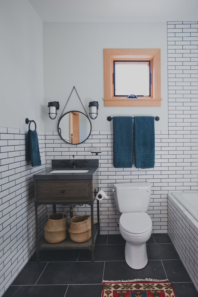 Example of a small transitional white tile and porcelain tile porcelain tile bathroom design in Portland with furniture-like cabinets, brown cabinets, a one-piece toilet, white walls, a console sink and quartz countertops