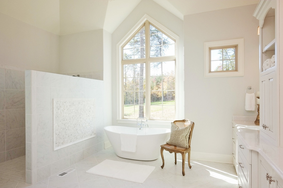 Example of a large transitional master white tile and porcelain tile ceramic tile and white floor bathroom design in Other with recessed-panel cabinets, white cabinets, white walls, an undermount sink and quartz countertops