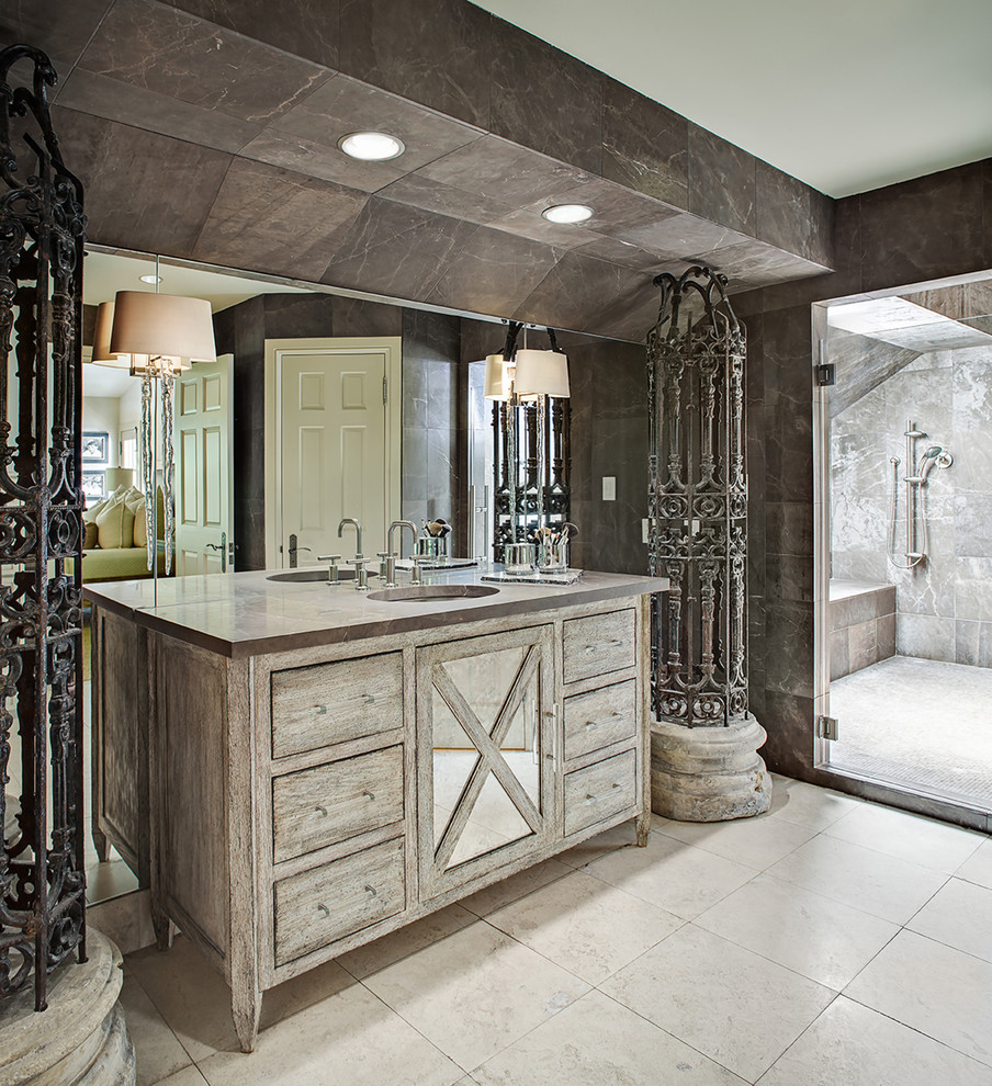 Idée de décoration pour une salle de bain tradition en bois vieilli avec un carrelage gris, un lavabo encastré, un sol beige, une cabine de douche à porte battante et un placard à porte plane.
