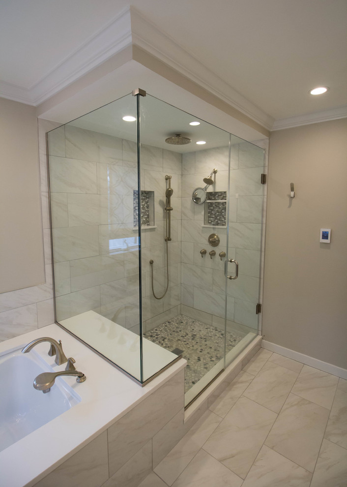 Example of a large transitional master white tile and porcelain tile porcelain tile corner shower design in Newark with shaker cabinets, gray cabinets, an undermount tub, a one-piece toilet, beige walls, an undermount sink and quartz countertops