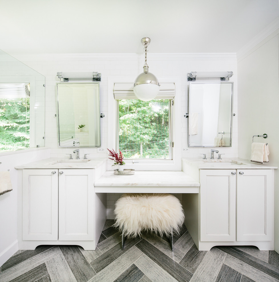 Photo of a traditional bathroom in Burlington with a submerged sink, shaker cabinets, white cabinets and white walls.