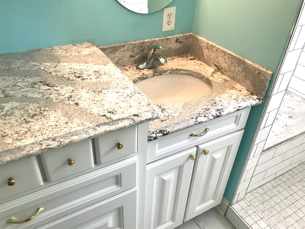 Inspiration for a large transitional master gray floor bathroom remodel in Cleveland with raised-panel cabinets, white cabinets, green walls, an undermount sink and quartz countertops