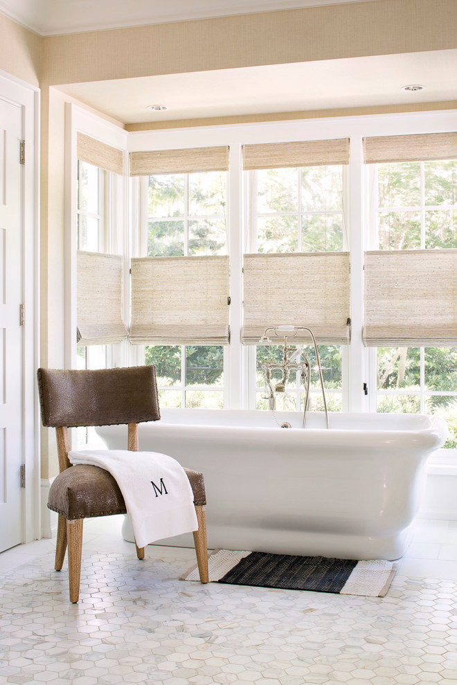Inspiration for a large transitional freestanding bathtub remodel in Miami with beige walls
