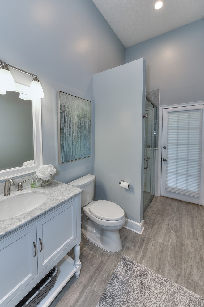 Photo of a medium sized classic bathroom in Jacksonville with glass tiles and marble worktops.