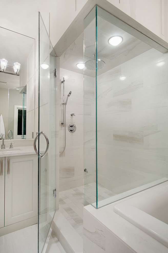 Inspiration for a classic bathroom in Calgary with a submerged sink, flat-panel cabinets, white cabinets, quartz worktops, a built-in bath, a corner shower, white tiles, porcelain tiles, grey walls and porcelain flooring.