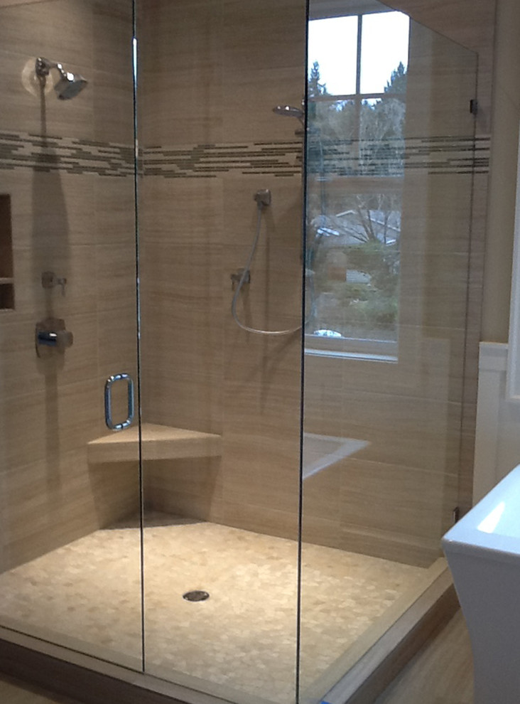 Photo of a classic bathroom in Portland with a freestanding bath, a corner shower and porcelain tiles.