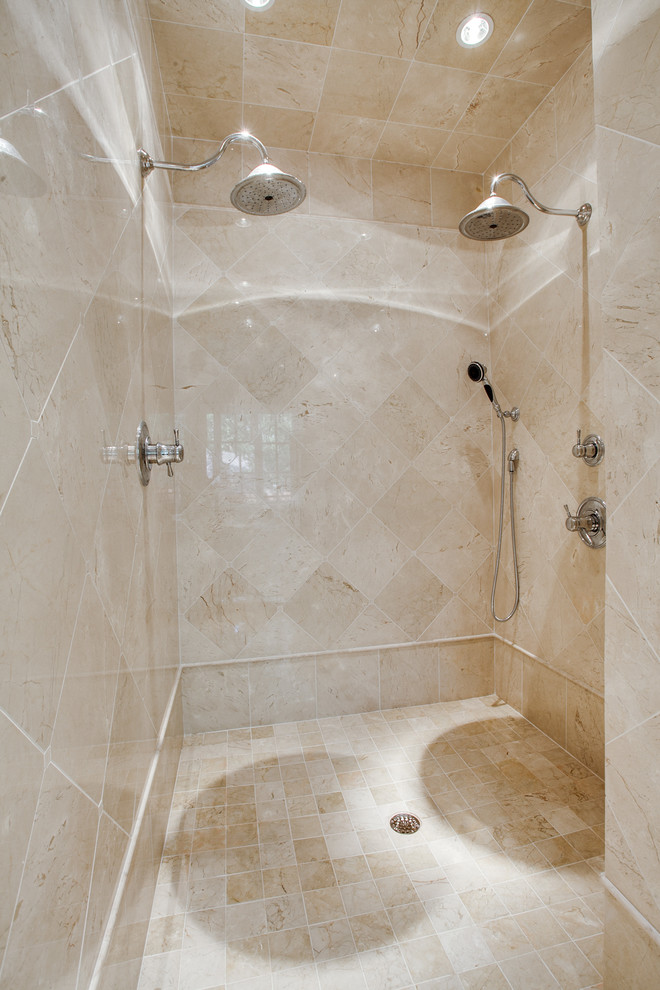 Double shower - traditional beige tile and stone tile marble floor double shower idea in Dallas