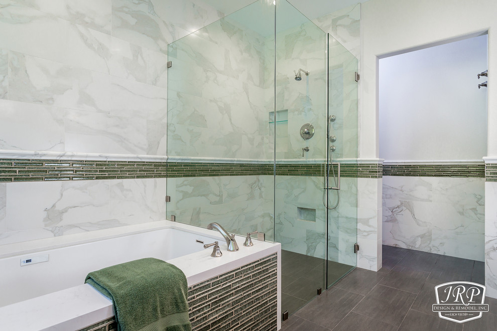 This is an example of a medium sized traditional ensuite bathroom in Los Angeles with shaker cabinets, white cabinets, a submerged bath, a built-in shower, a wall mounted toilet, white tiles, porcelain tiles, white walls, ceramic flooring, a submerged sink, engineered stone worktops and a hinged door.
