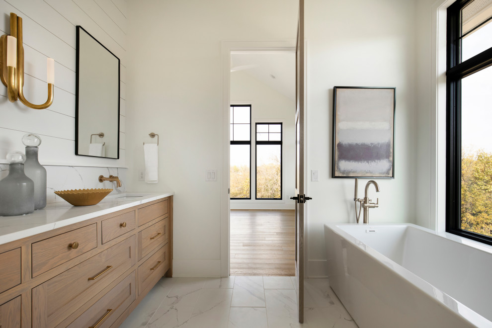 Freestanding bathtub - huge transitional master ceramic tile, white floor, double-sink and shiplap wall freestanding bathtub idea in Minneapolis with beige cabinets, white walls, quartz countertops, white countertops and a built-in vanity