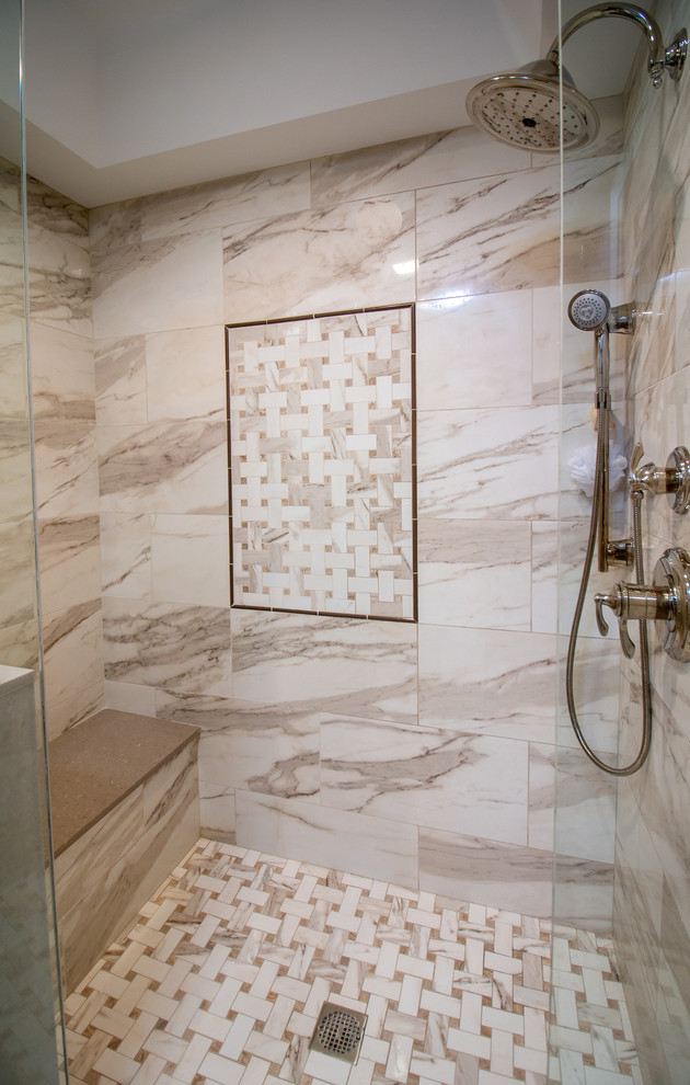 Photo of a medium sized classic ensuite bathroom in Manchester with recessed-panel cabinets, white cabinets, an alcove shower, a two-piece toilet, beige tiles, porcelain tiles, brown walls, porcelain flooring, a built-in sink, engineered stone worktops, brown floors, a hinged door and beige worktops.