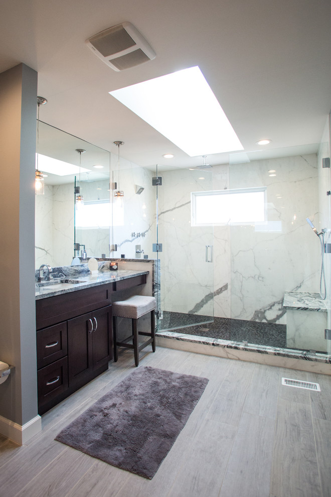 Photo of a large traditional ensuite bathroom in Cleveland with shaker cabinets, dark wood cabinets, an alcove shower, grey walls, porcelain flooring, a submerged sink and granite worktops.