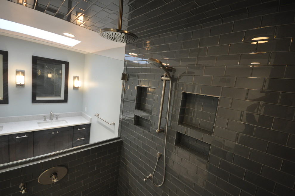 Double shower - mid-sized transitional master black tile and subway tile beige floor double shower idea in DC Metro with shaker cabinets, black cabinets, a one-piece toilet, blue walls, a wall-mount sink and a hinged shower door