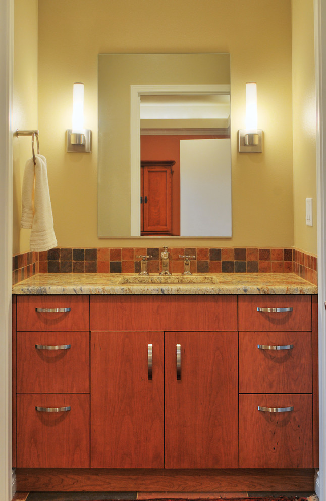 Inspiration för mellanstora klassiska badrum med dusch, med släta luckor, skåp i mellenmörkt trä, flerfärgad kakel, ett undermonterad handfat, granitbänkskiva, keramikplattor och gula väggar