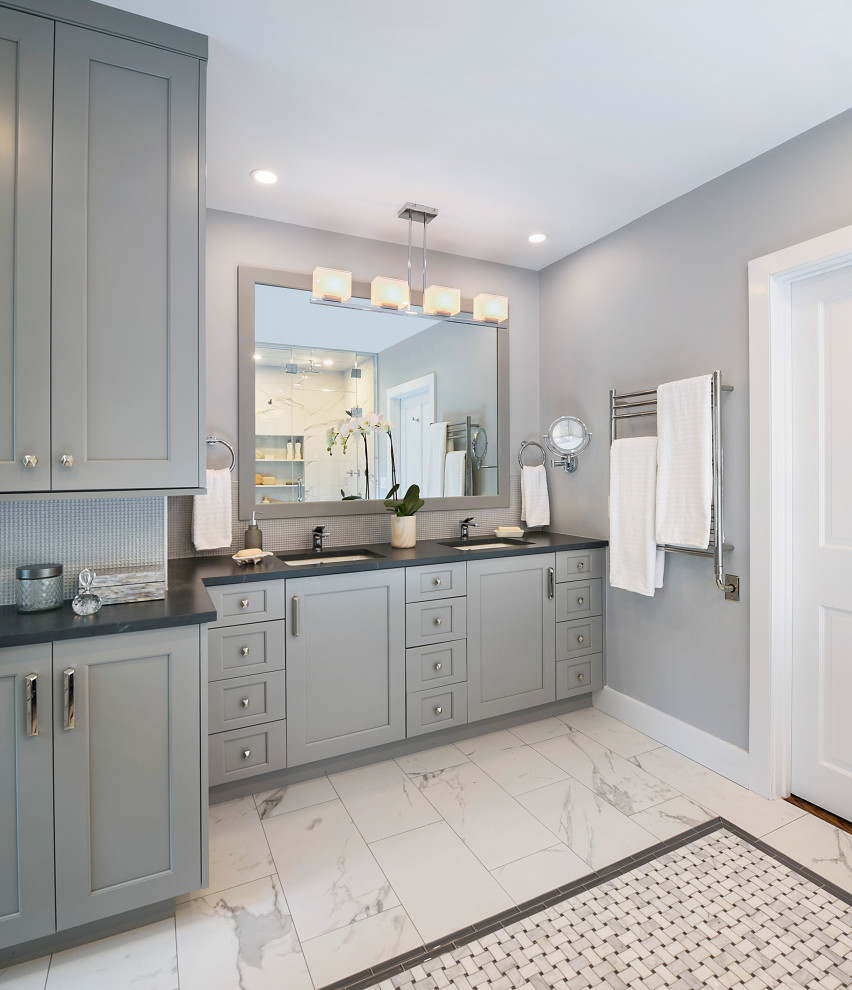 Inspiration for a transitional gray tile marble floor, gray floor and double-sink doorless shower remodel in Boston with gray cabinets, gray walls, an undermount sink, quartz countertops, a hinged shower door and black countertops