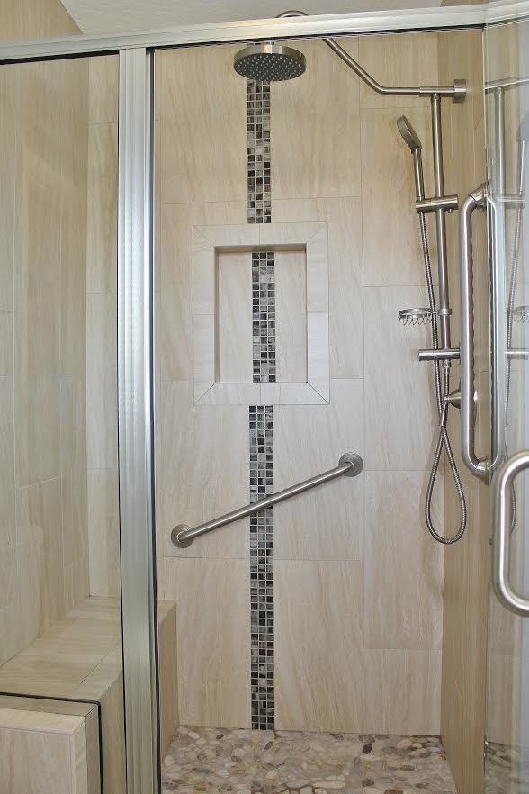 Medium sized coastal shower room bathroom in Orange County with raised-panel cabinets, white cabinets, a corner bath, a walk-in shower, a one-piece toilet, beige tiles, brown tiles, white tiles, stone slabs, blue walls, ceramic flooring, a built-in sink and granite worktops.