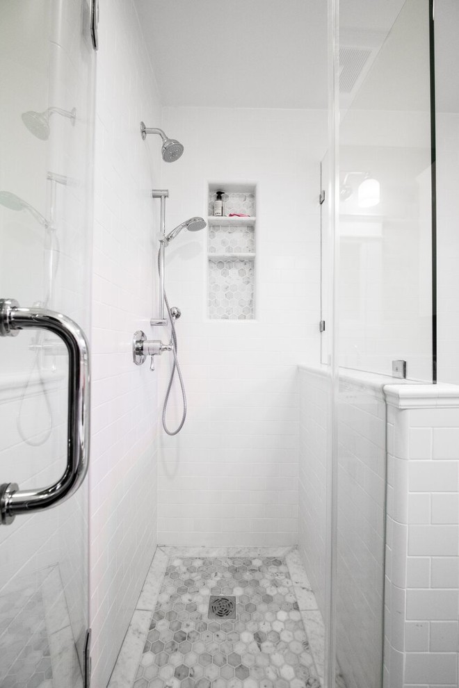 Inspiration for a classic bathroom in San Francisco with a corner shower, white tiles, metro tiles, marble flooring, grey floors, a hinged door, an alcove bath, a one-piece toilet, white walls and a pedestal sink.