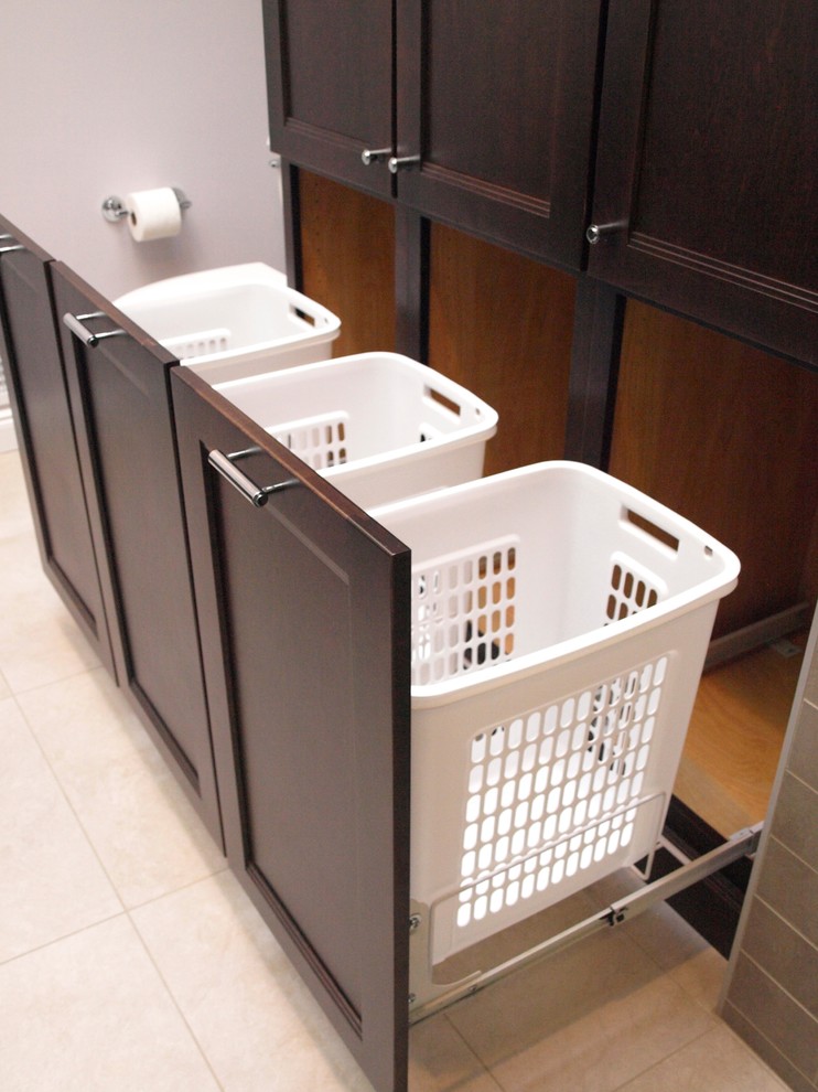 Large transitional master beige tile and ceramic tile porcelain tile and beige floor bathroom photo in Newark with flat-panel cabinets, brown cabinets, a two-piece toilet, beige walls, an undermount sink and granite countertops