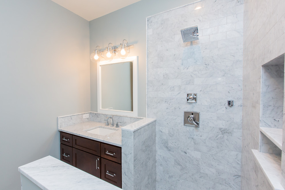 Medium sized classic shower room bathroom in Seattle with shaker cabinets, medium wood cabinets, a corner shower, white tiles, metro tiles, grey walls, marble flooring, a submerged sink, marble worktops, white floors and white worktops.