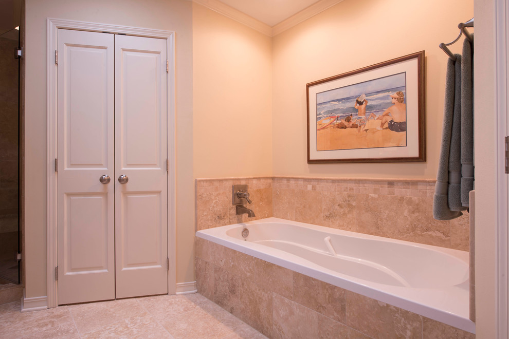 Exemple d'une douche en alcôve chic en bois foncé avec un lavabo encastré, un placard avec porte à panneau encastré, un plan de toilette en granite, une baignoire posée, WC séparés, un carrelage beige et des carreaux de céramique.