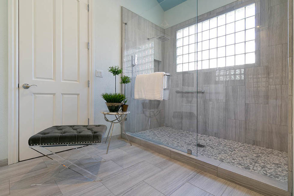 Bathroom - large transitional master multicolored tile and glass sheet ceramic tile and gray floor bathroom idea in San Francisco with shaker cabinets, white cabinets, a two-piece toilet, white walls, an undermount sink, quartz countertops, a hinged shower door and white countertops