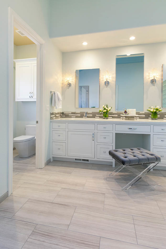Inspiration for a large classic ensuite bathroom in San Francisco with shaker cabinets, white cabinets, a corner bath, a corner shower, a two-piece toilet, multi-coloured tiles, glass sheet walls, white walls, ceramic flooring, a submerged sink, engineered stone worktops, grey floors, a hinged door and white worktops.
