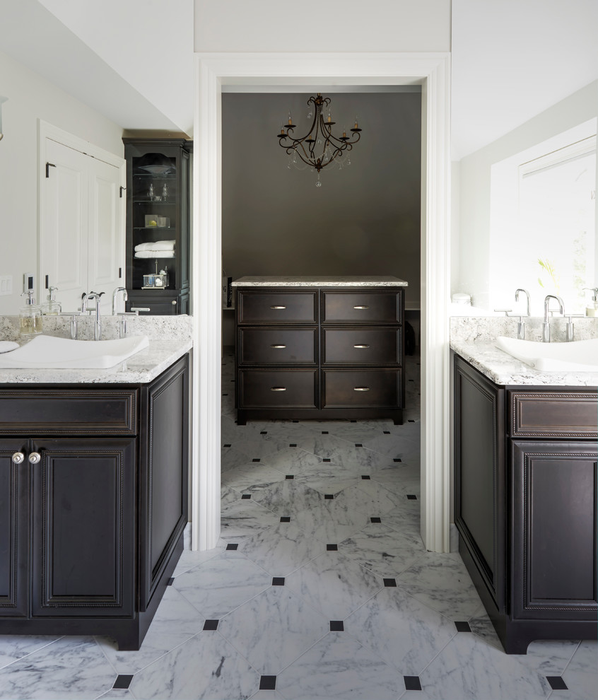 Design ideas for a large classic ensuite bathroom in Chicago with recessed-panel cabinets, dark wood cabinets, a freestanding bath, a corner shower, a two-piece toilet, black and white tiles, stone tiles, white walls, marble flooring, a vessel sink and granite worktops.