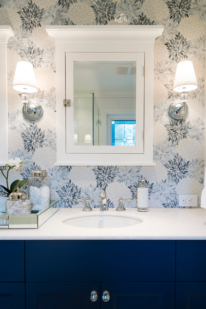 Inspiration for a medium sized traditional ensuite bathroom in Vancouver with shaker cabinets, blue cabinets, a corner shower, a two-piece toilet, multi-coloured tiles, grey walls, mosaic tile flooring, a submerged sink and quartz worktops.