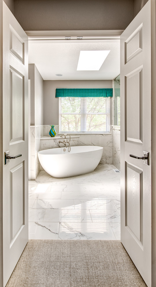 Inspiration for a large traditional ensuite bathroom in Denver with flat-panel cabinets, grey cabinets, a freestanding bath, a corner shower, a one-piece toilet, white tiles, porcelain tiles, beige walls, porcelain flooring, a submerged sink and engineered stone worktops.