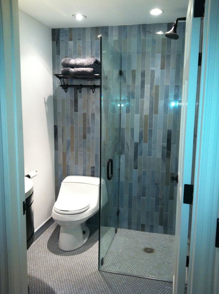 Walk-in shower - small modern 3/4 blue tile, green tile and glass tile mosaic tile floor and gray floor walk-in shower idea in Los Angeles with dark wood cabinets, a one-piece toilet, white walls, a wall-mount sink, solid surface countertops and a hinged shower door
