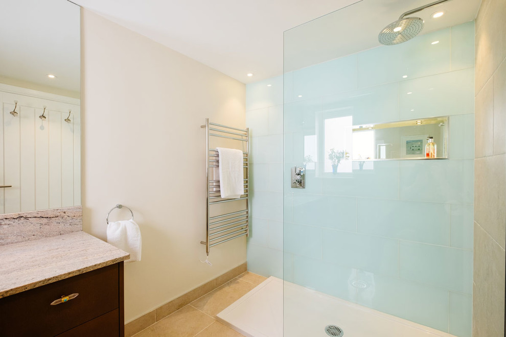 Design ideas for a medium sized contemporary ensuite bathroom in Cornwall with flat-panel cabinets, brown cabinets, a walk-in shower, white tiles, ceramic tiles, white walls, porcelain flooring, marble worktops, an open shower and a built in vanity unit.