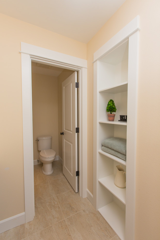 Example of a small classic kids' beige tile ceramic tile bathroom design in Portland with a drop-in sink, shaker cabinets, dark wood cabinets, granite countertops, a one-piece toilet and beige walls