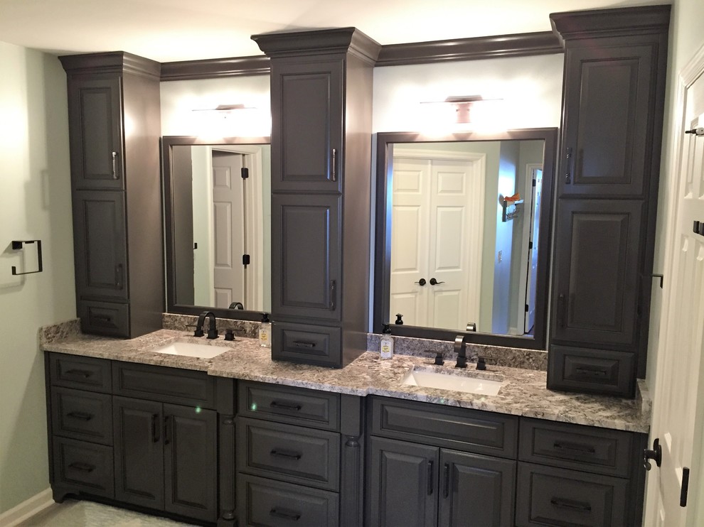 Medium sized classic ensuite bathroom in Nashville with porcelain flooring, a submerged sink, grey floors, a hinged door, raised-panel cabinets, brown cabinets, a corner shower, grey tiles, porcelain tiles, green walls and granite worktops.