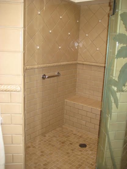 Large world-inspired ensuite bathroom in San Diego with a corner shower, beige tiles, ceramic tiles, beige walls and ceramic flooring.