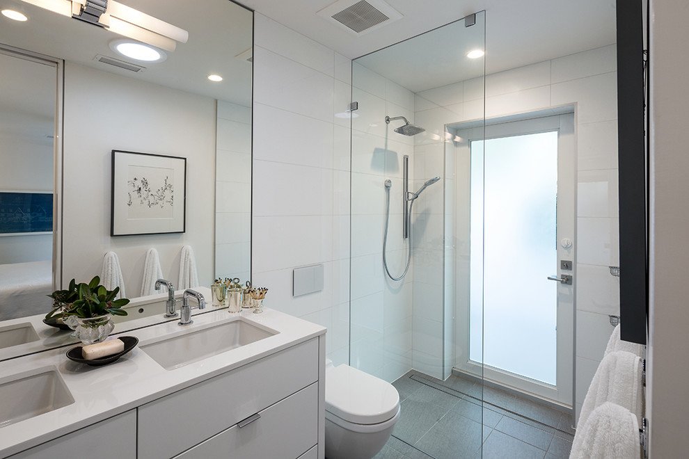 Design ideas for a small contemporary ensuite bathroom in Miami with a walk-in shower, white tiles, white walls and porcelain flooring.