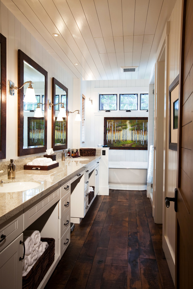 Inspiration for a rustic bathroom in San Francisco with a freestanding bath, a submerged sink, white cabinets, dark hardwood flooring and recessed-panel cabinets.