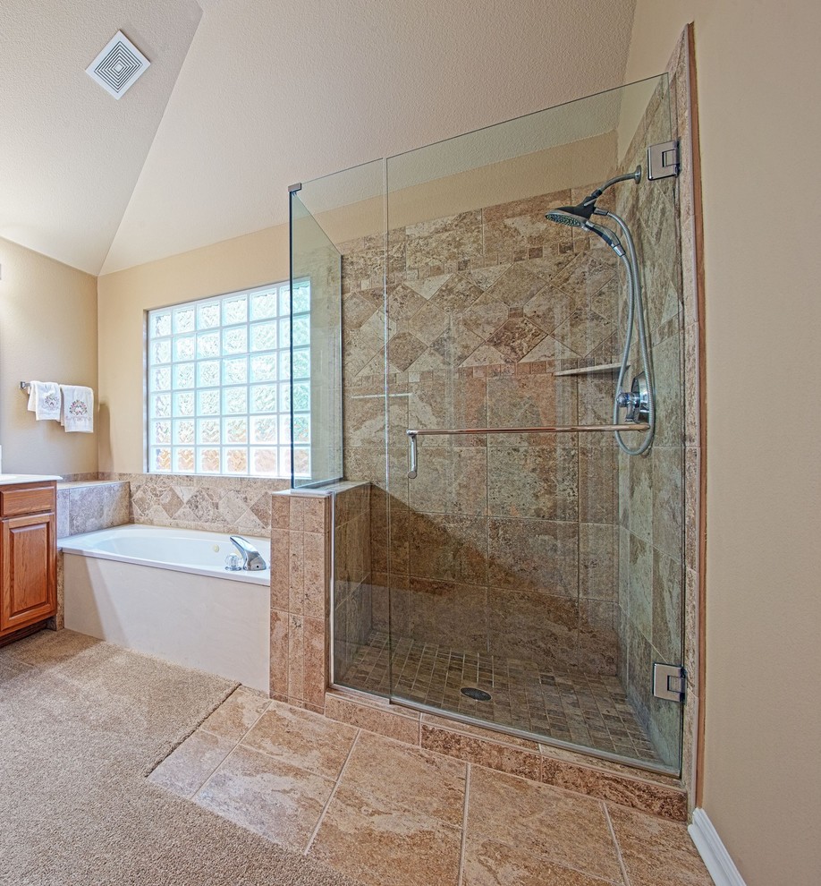 Photo of a medium sized traditional ensuite bathroom in Austin with an alcove bath, a corner shower, beige tiles, ceramic tiles, beige walls, ceramic flooring, beige floors and a hinged door.