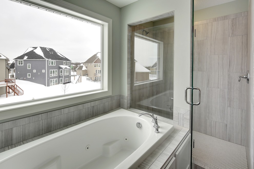 Example of a large transitional master gray tile and ceramic tile porcelain tile bathroom design in Minneapolis with an undermount sink, shaker cabinets, white cabinets, quartz countertops, a one-piece toilet and green walls