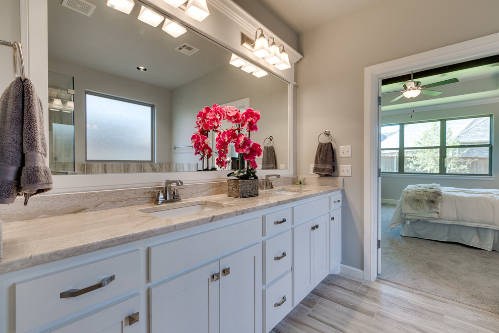 Photo of a medium sized traditional ensuite bathroom in Oklahoma City with shaker cabinets, white cabinets, a corner shower, beige tiles, cement tiles, grey walls and marble worktops.