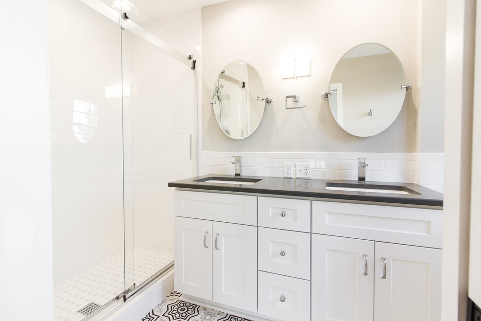 Design ideas for a small country ensuite bathroom in Other with shaker cabinets, white cabinets, a walk-in shower, a two-piece toilet, white tiles, metro tiles, grey walls, ceramic flooring, a submerged sink, engineered stone worktops, grey floors, a sliding door and grey worktops.