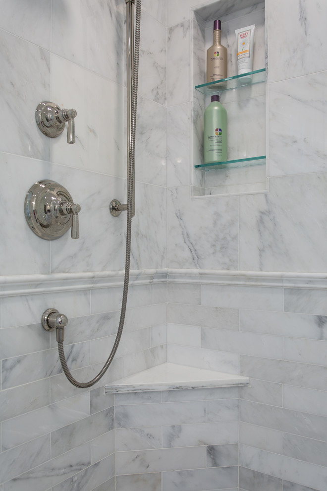 Mid-sized elegant master white tile and marble tile marble floor and white floor corner shower photo in Boston with shaker cabinets, white cabinets, an undermount tub, a two-piece toilet, gray walls, an undermount sink, marble countertops, a hinged shower door and white countertops