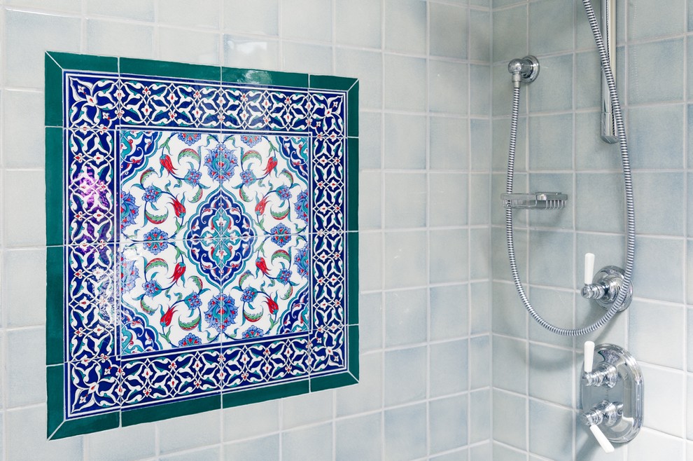 Bathroom - mid-sized mediterranean 3/4 blue tile, red tile, white tile and ceramic tile ceramic tile and multicolored floor bathroom idea in Los Angeles with shaker cabinets, white cabinets, a two-piece toilet, white walls, an undermount sink, quartz countertops and a hinged shower door