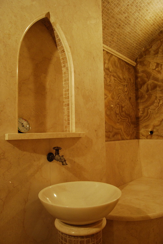 Example of an asian marble floor bathroom design in Other with beige walls and a pedestal sink
