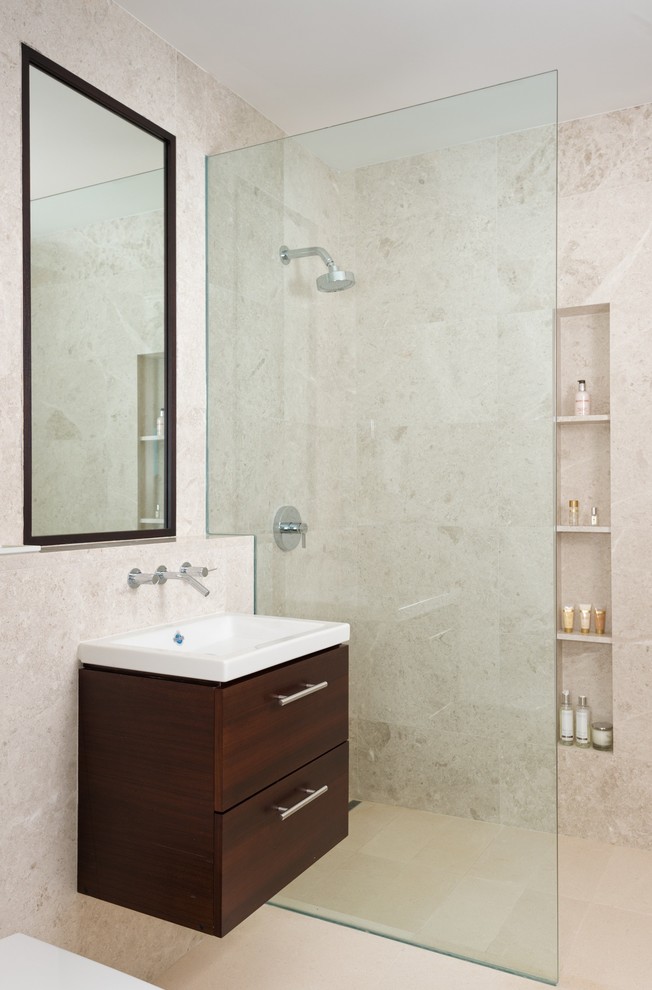 Inspiration for a medium sized world-inspired family bathroom in London with freestanding cabinets, dark wood cabinets, tiled worktops, a walk-in shower, a wall mounted toilet, white tiles, ceramic tiles, beige walls and limestone flooring.