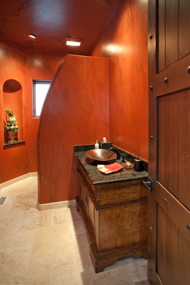 シカゴにある中くらいなエクレクティックスタイルのおしゃれなバスルーム (浴槽なし) (家具調キャビネット、濃色木目調キャビネット、赤い壁、ライムストーンの床、ベッセル式洗面器、御影石の洗面台) の写真