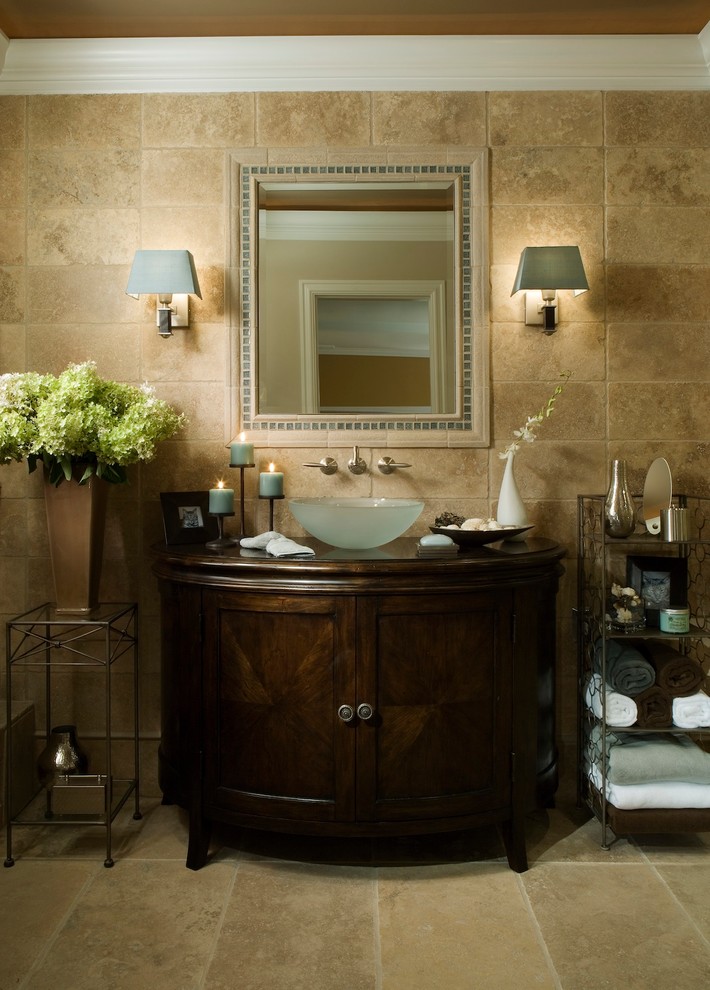 Eclectic master beige tile and stone tile marble floor bathroom photo in Detroit with a vessel sink, furniture-like cabinets, dark wood cabinets, wood countertops and brown walls