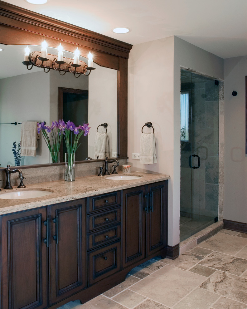 Photo of a large traditional ensuite bathroom in Chicago with a submerged sink, dark wood cabinets, granite worktops, an alcove shower, white walls, raised-panel cabinets, grey tiles, slate tiles, slate flooring, grey floors and a hinged door.