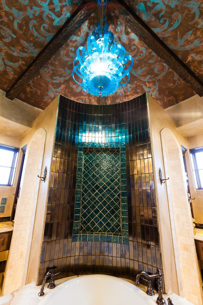 This is an example of a medium sized mediterranean ensuite bathroom in Austin with a built-in bath, brown tiles, green tiles, multi-coloured tiles, metal tiles and beige walls.